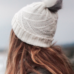 Knitted white pompom cap